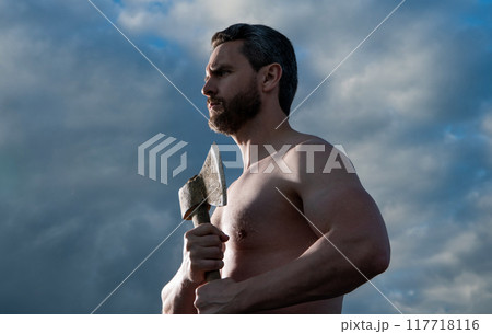 shirtless man with axe. caucasian woodsman man hold ax. brutal man on sky background shirtless man with axe. caucasian woodsman man hold ax. brutal man on sky background 117718116