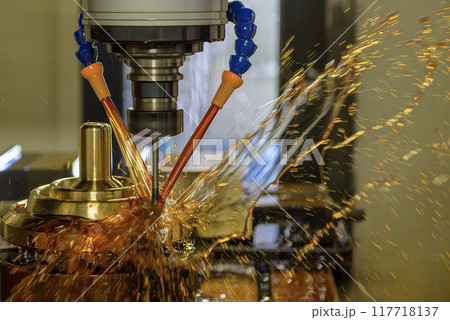 The CNC milling machine cutting the shell mold parts with oil coolant method. 117718137