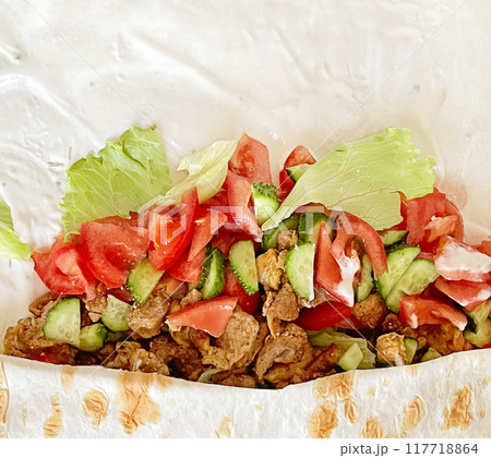 Fresh shawarma or chicken arabic doner sandwich with white background with copy space 117718864