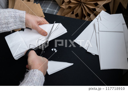 Master class of making craft paper snowflakes for conscientious Christmas decor. Sustainable celebration minimal responsible DIY holiday project. Step by step Master class of making craft paper snowflakes for conscientious Christmas decor. Sustainable celebration minimal responsible DIY holiday project. Step by step 117718910