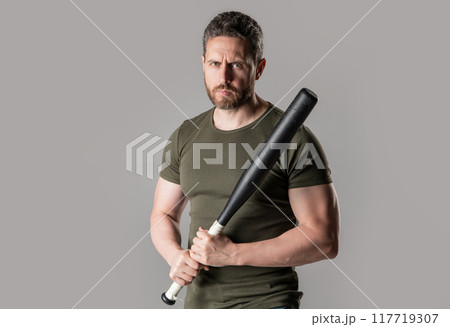 serious man express aggression with bat isolated on grey background. aggression of man 117719307