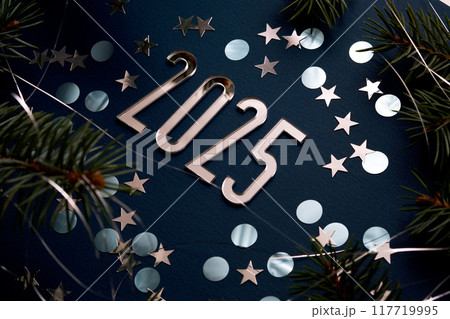 New Year 2025 blue background. Number of the coming year in Christmas decoration. New Year 2025 blue background. Number of the coming year in Christmas decoration. 117719995