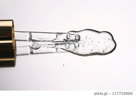 Pipette with cosmetic gel or serum close-up. 117720008