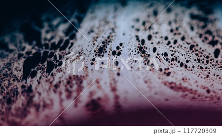 Fizzy fluid texture. Acid liquid. Defocused blue pink color oil emulsion leak puddle slick on dark black light flare abstract art background. Fizzy fluid texture. Acid liquid. Defocused blue pink color oil emulsion leak puddle slick on dark black light flare abstract art background. 117720309