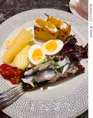 breakfast with egg and Baltic herring in cafe breakfast with egg and Baltic herring in cafe 117720436