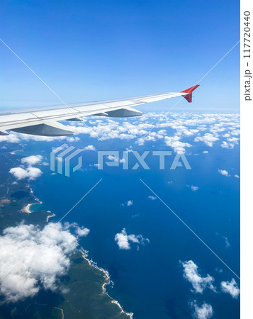 airplane wing and aerial view blue sea coastline airplane wing and aerial view blue sea coastline 117720440