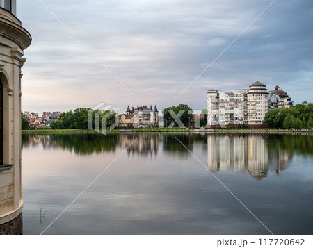 reflection of houses on water surface of pond 117720642