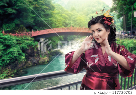 Timeless Tradition Meets Modern Travel: Tourist's Elegant Kimono Pose Highlights Japan's Enduring Cultural Appeal. 117720702