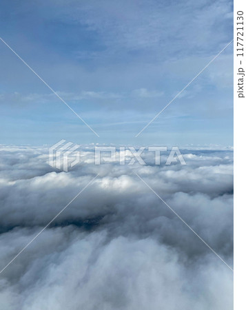 above view of clouds covered sky through window 117721130