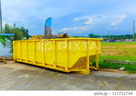 Construction site dumpsters of metal containers for collection of waste during construction Construction site dumpsters of metal containers for collection of waste during construction 117722744