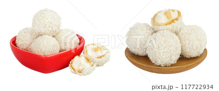 round candy raffaello with coconut flakes and nut in ceramic bowl isolated on white background 117722934