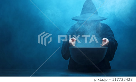 Witch brewing potion in a dark, misty setting 117723428
