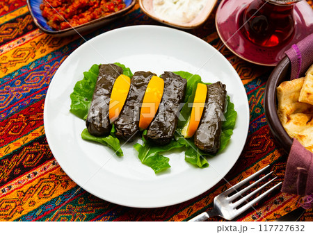 A Turkish snack wrapped in grape leaves is called Yaprak Sarma. 117727632
