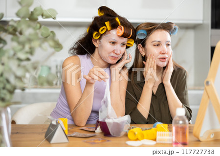 Adult and young women use face masks Adult and young women use face masks 117727738