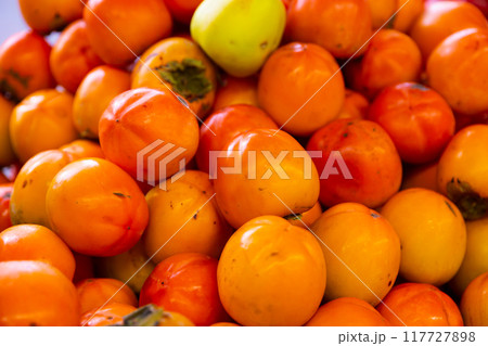 Many of fresh persimmons 117727898