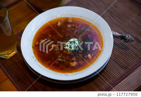 Traditional Russian meat soup Solyanka with sour cream and lemon Traditional Russian meat soup Solyanka with sour cream and lemon 117727950