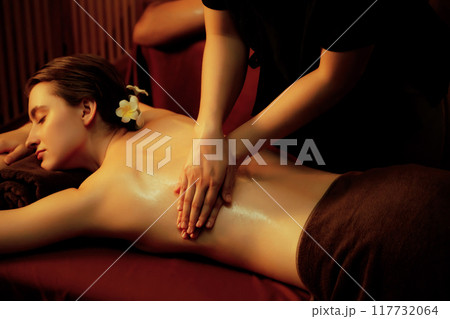 Caucasian woman customer enjoying relaxing anti-stress massage. Quiescent 117732064