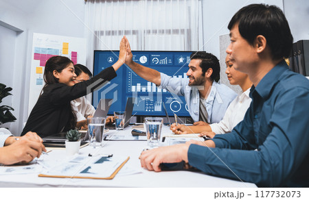 Analyst team leader celebrate with colleague after successful meeting. Prudent 117732073