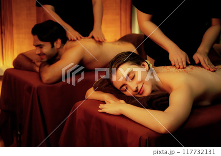 Couple customer having exfoliation treatment in luxury spa. Quiescent 117732131
