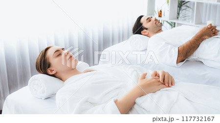 Caucasian couple customer enjoying relaxing anti-stress massage. Quiescent 117732167