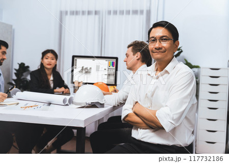 Diverse group of civil engineer and client working on architect. Prudent 117732186