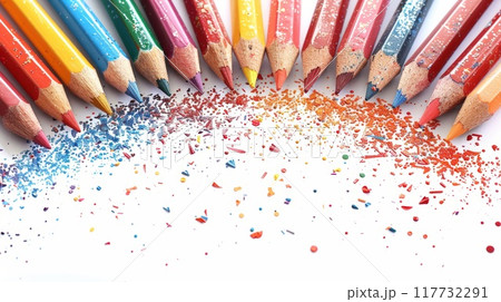 Vibrant and Colorful Education Back to School Background with Rainbow Colored Pencils and Artistic Crayon Shavings 117732291