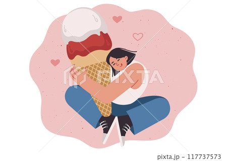 Woman hugs large ice cream made of creamy fruit filling in waffle cone and smiles 117737573