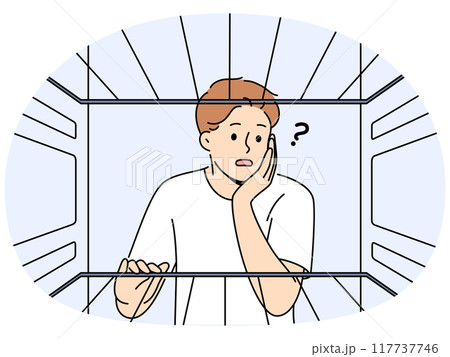 Hungry man sees empty refrigerator and is nervous about lack food due to poverty 117737746