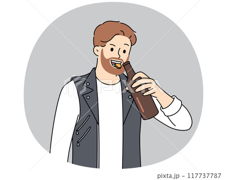 Brutal man opens bottle of beer with teeth and smiles, suffering from alcohol addiction. 117737787