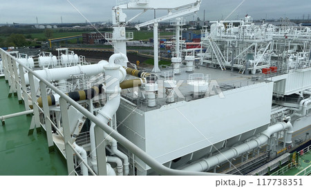 LNG ship in the terminal unloading of natural liquefied gas. Energy supply 117738351