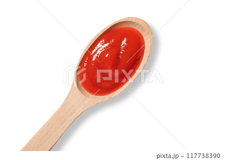 Wooden spoon with tomato ketchup on white background Wooden spoon with tomato ketchup on white background 117738390