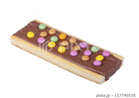 Chocolate bar snack with colorful drops or dragee isolated on the white Chocolate bar snack with colorful drops or dragee isolated on the white 117740558