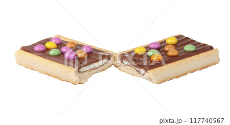 Chocolate bar snack with colorful drops or dragee isolated on the white 117740567