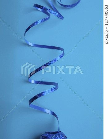 party ribbon confetti on blue 117740663