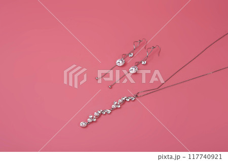 vintage elegant jewelry on pink background 117740921