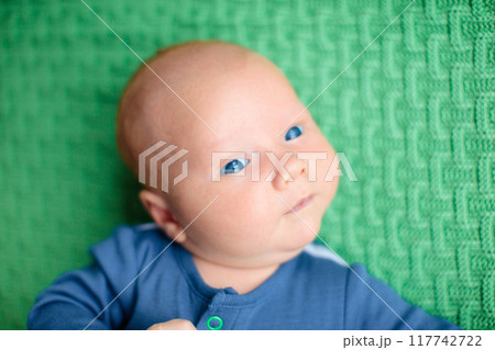 Little baby on colorful knitted blanket Little baby on colorful knitted blanket 117742722