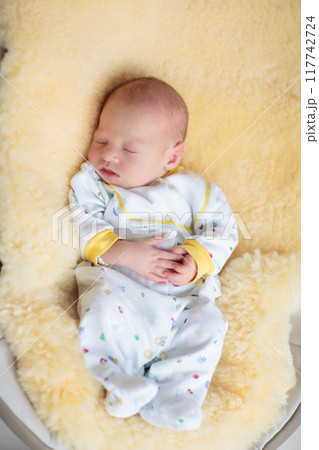Little baby on white bed Little baby on white bed 117742724