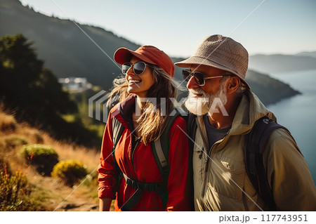 Awe-Inspiring Retirement Senior Couple Marvels at Pacific Coast Beauty, Embracing Nature's Wonders on a Mountain Hiking Adventure. created with Generative AI Awe-Inspiring Retirement Senior Couple Marvels at Pacific Coast Beauty, Embracing Nature's Wonders on a Mountain Hiking Adventure. created with Generative AI 117743951