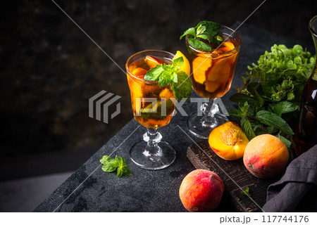 Cold ice tea with peach and mint 117744176