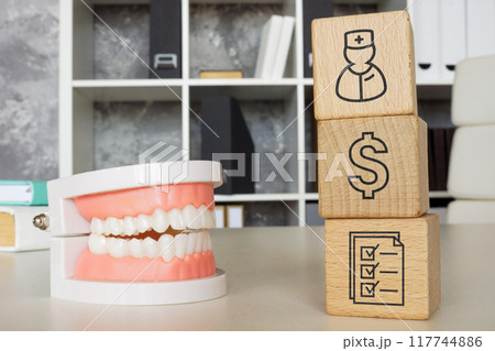 Jaw model and cubes as a concept of dental insurance. Jaw model and cubes as a concept of dental insurance. 117744886