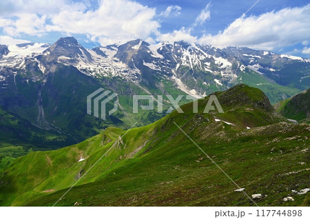 A bench with a view of the mountains in Austria. Landscape with nature in the Alps. A great place for sports, recreation and outdoor activity holidays. Grossglockner - the highest mountain in Austria 117744898
