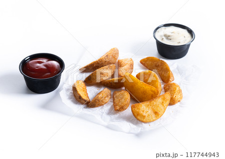 Fried potato wedges isolated on white background. 117744943