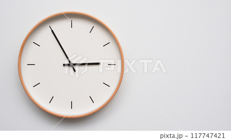 Minimalist wooden Wall Clock on White Wooden Surface with Space for Text. Time Set at 14.55, 02.55 Minimalist wooden Wall Clock on White Wooden Surface with Space for Text. Time Set at 14.55, 02.55 117747421