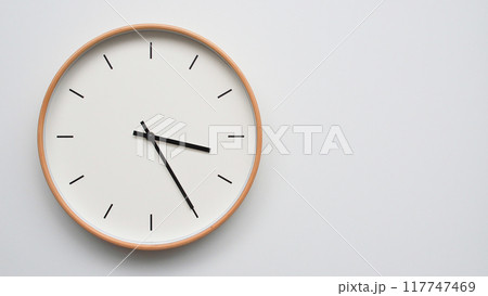 Minimalist wooden Wall Clock on White Wooden Surface with Space for Text. Time Set at 15.25/03.25 Minimalist wooden Wall Clock on White Wooden Surface with Space for Text. Time Set at 15.25/03.25 117747469