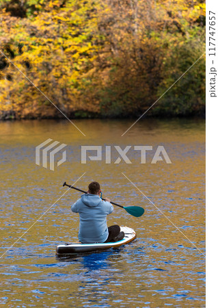 Supboarding in Autumn Foliage 117747657
