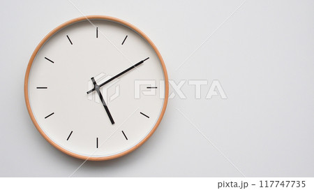 Minimalist wooden Wall Clock on White Wooden Surface with Space for Text. Time Set at 17.10/05.10 Minimalist wooden Wall Clock on White Wooden Surface with Space for Text. Time Set at 17.10/05.10 117747735