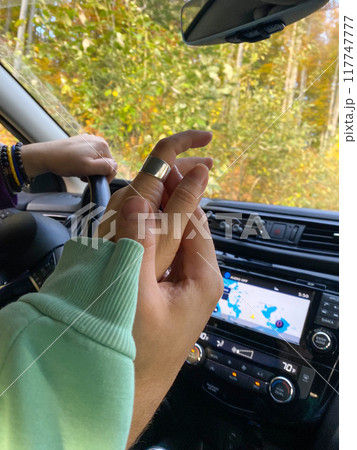 Couple Holding Hands in Car 117747777