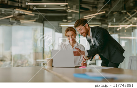 Participating in a collaborative business meeting that takes place in a modern office space Participating in a collaborative business meeting that takes place in a modern office space 117748881