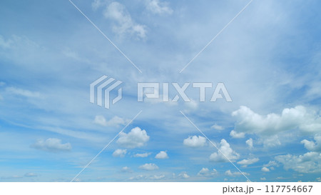 Fluffy layered clouds sky atmosphere. Puffy fluffy white clouds. Formation cloud sky scape. Timelapse. 117754667