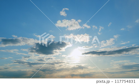 Beautiful blue sky with sunbeams and clouds. Clouds at blue sky background. Sunny cloudscape. Timelapse. Beautiful blue sky with sunbeams and clouds. Clouds at blue sky background. Sunny cloudscape. Timelapse. 117754831